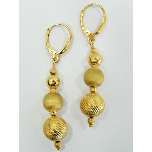 305 - Lovely Pair of 9ct Gold Graduated ball drop earrings. Each earring measures approx 50mm long. Total ... 