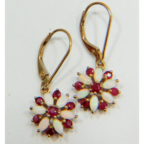 306 - Pair of 9ct Gold Pearl and Ruby set earrings in a flower pattern. Each 25mm drop. Total weight 2.0g