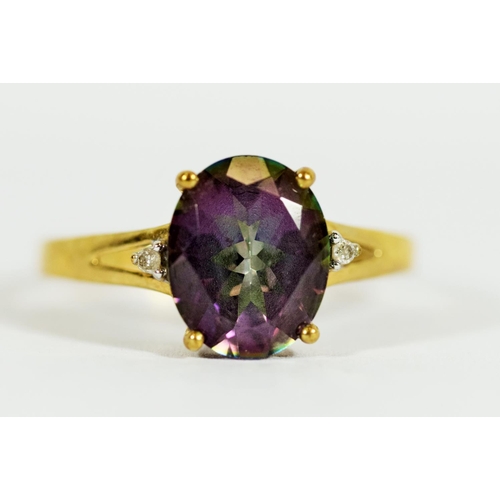 308 - 9ct Yellow Gold ring set with a Central Mystic Topaz which measures 11 x 8 mm, Accompanied by two Me... 