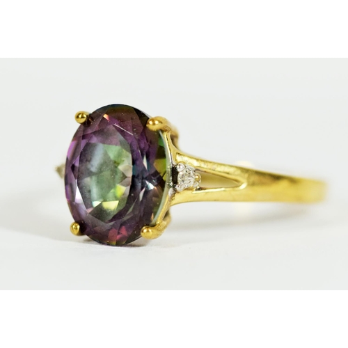 308 - 9ct Yellow Gold ring set with a Central Mystic Topaz which measures 11 x 8 mm, Accompanied by two Me... 