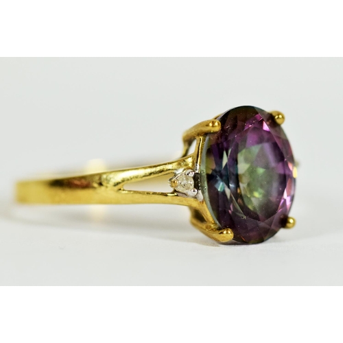 308 - 9ct Yellow Gold ring set with a Central Mystic Topaz which measures 11 x 8 mm, Accompanied by two Me... 