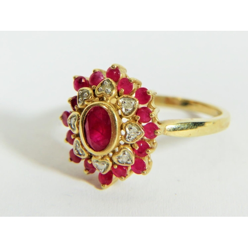 313 - 9ct Yellow Gold Diamond and Ruby set Flower pattern ring. Finger size 'P'  3.9g