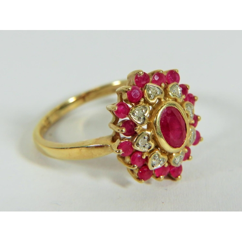 313 - 9ct Yellow Gold Diamond and Ruby set Flower pattern ring. Finger size 'P'  3.9g