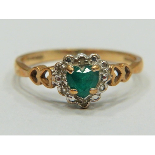 316 - 9ct Yellow Gold ring set with a Central Heart shaped Emerald with Melee Diamond surround.   Finger s... 