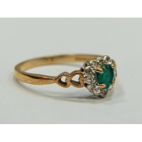 316 - 9ct Yellow Gold ring set with a Central Heart shaped Emerald with Melee Diamond surround.   Finger s... 