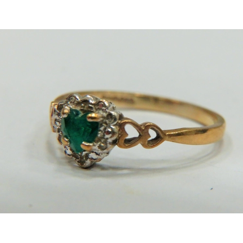 316 - 9ct Yellow Gold ring set with a Central Heart shaped Emerald with Melee Diamond surround.   Finger s... 