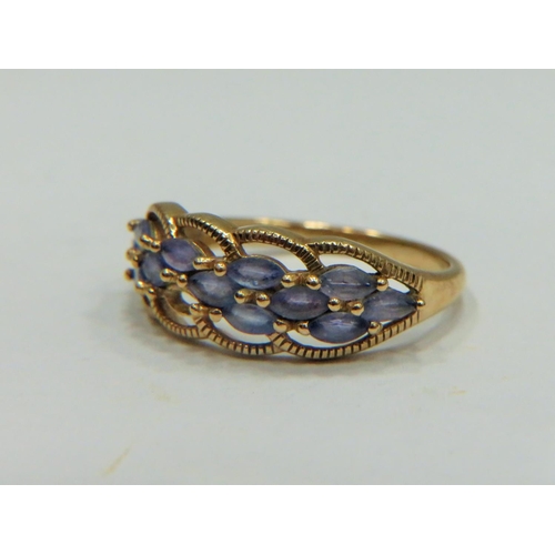 317 - 9ct Yellow Gold ring set with multiple Topaz.   Finger size 'P-5 to Q'   2.4g