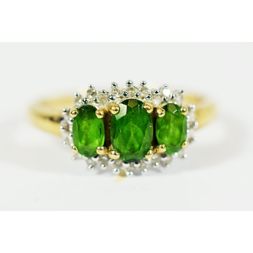 318 - 9ct Yellow Gold Ring set with Three Central Emeralds with Diamond Surround..   Finger size 'Q-5 to R... 