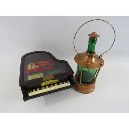 240 - Musical decanter in the form of a lantern and a musical jewellery box in the form of a piano.