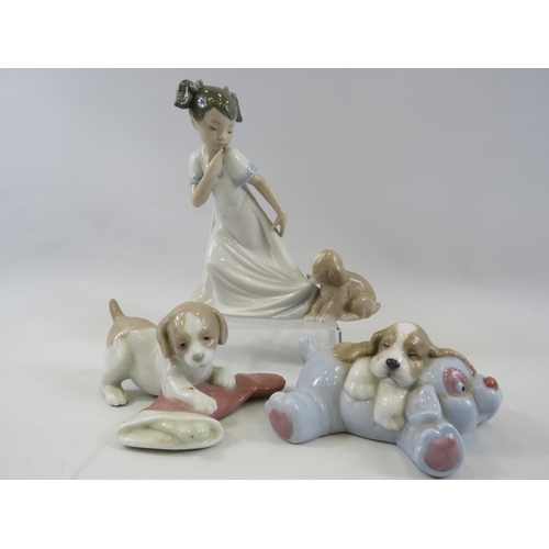 264 - 3 Nao figurines, girl with puppy and 2 puppies with toys.