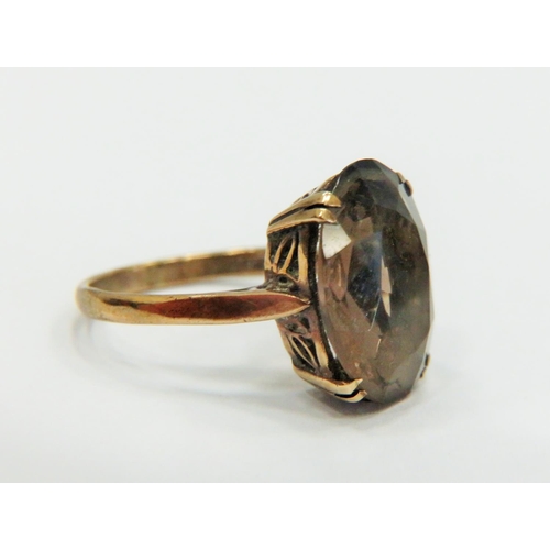 331 - 9ct Yellow Gold ring set with a large Oval Smokey Quartz which measures 15 x 10 mm.  Finger size 'L-... 