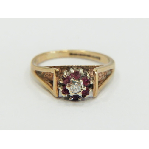 332 - 9ct Yellow Gold Ring set with a small central Diamond, surrounded by small Rubies. Small finger size... 