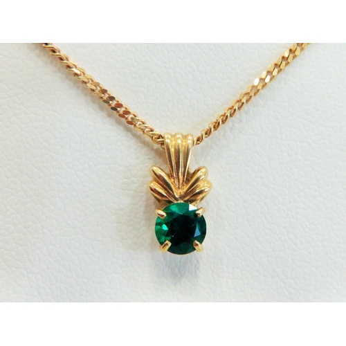 334 - 9ct Yellow Gold Emerald coloured Circular CZ set pendant hung upon an 18 inch chain.  Total Weight  ... 