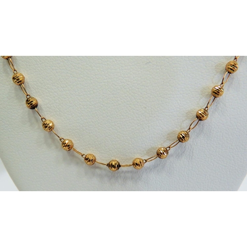 355 - 9ct Yellow Gold 20 inch Neck Chain interspersed with small globes between links.  Total weight appro... 