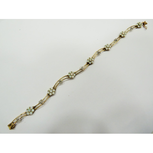 362 - Lovely 9ct Yellow Gold Wave bracelet set with seven, opal cluster flowers and interspersed with seve... 