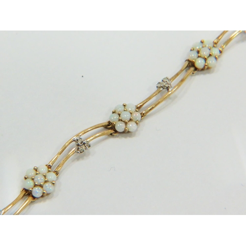 362 - Lovely 9ct Yellow Gold Wave bracelet set with seven, opal cluster flowers and interspersed with seve... 