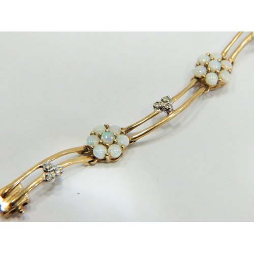 362 - Lovely 9ct Yellow Gold Wave bracelet set with seven, opal cluster flowers and interspersed with seve... 