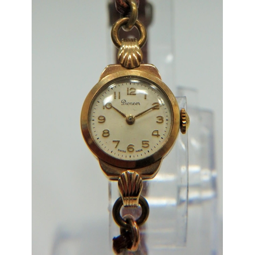 369 - Swiss Made ladies watch by 'Pioneer' in running order. 9ct Gold case. Worn leather strap. See photos... 