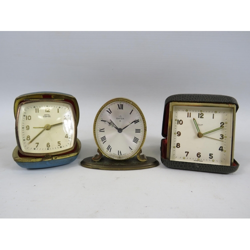 2 Vintage travel clocks and a small mantle clock by Smiths and Swiza.