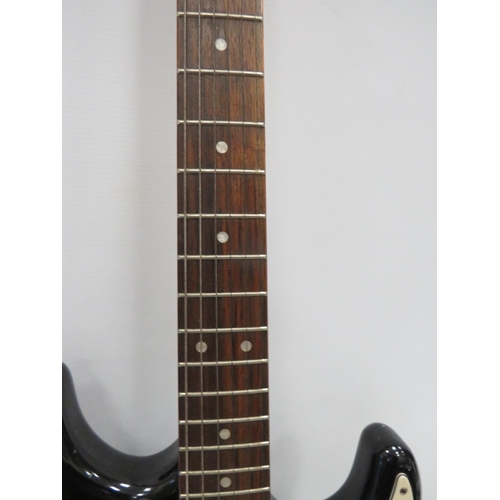 651 - Six String Electric Guitar with soft leatherette carry case. See photos.