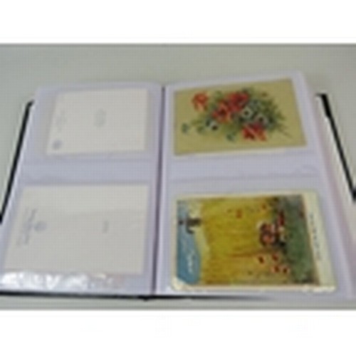 676 - 105 Poppy related postcards in a album some which are embroided.  PA647