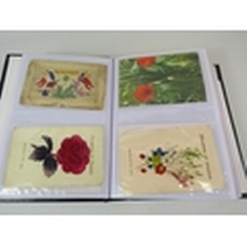 676 - 105 Poppy related postcards in a album some which are embroided.  PA647