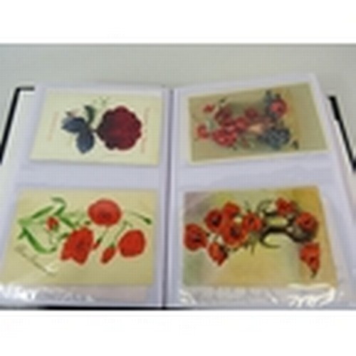 676 - 105 Poppy related postcards in a album some which are embroided.  PA647