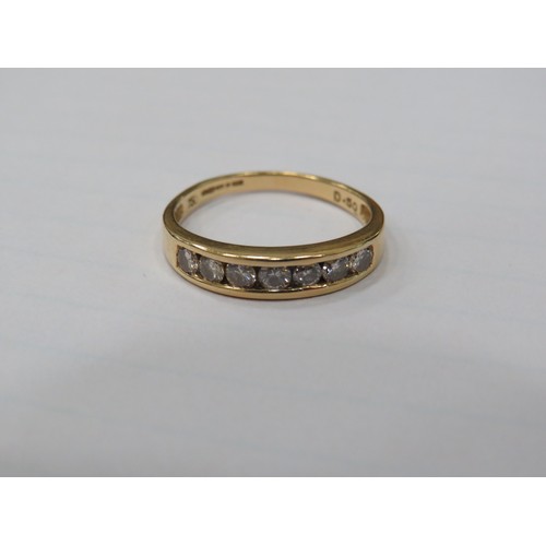 302 - 18ct Yellow Gold Ring set with Seven Diamonds of approx 0.07pts each. Finger size 'P'  2.9g