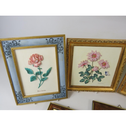 31 - Four M&S Hand painted resin wall plaques together with Framed Capodimonte floral displays.   See pho... 