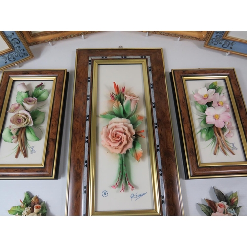 31 - Four M&S Hand painted resin wall plaques together with Framed Capodimonte floral displays.   See pho... 