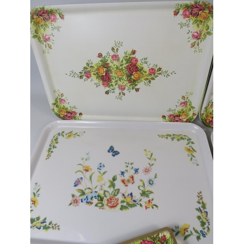 37 - Two Aynsley Plastic Trays in the Cottage Garden pattern together with other Melamime place mats/coas... 