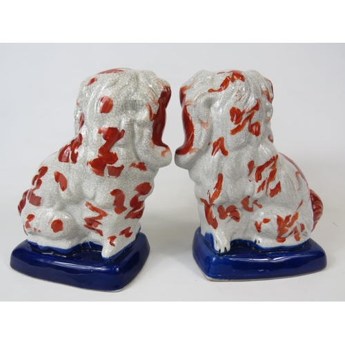 38 - Vintage Matched pair of Mantle Dogs (King Charles) Largest measures approx 9 inches tall. Some lifti... 