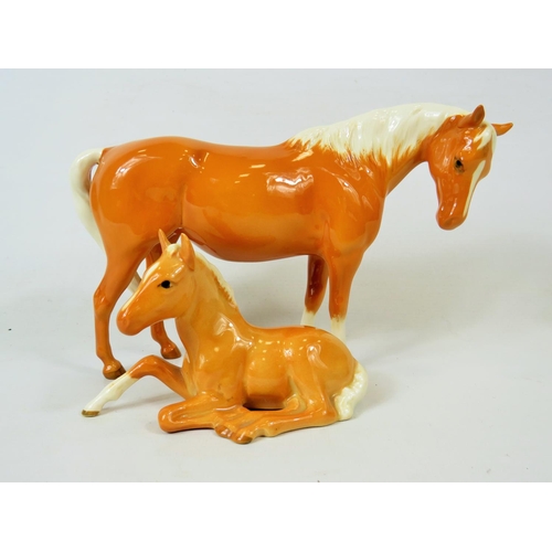 39 - Beswick Palamino Mare facing Right along with a Beswick Palamino lying down foal (915).  Both in exc... 