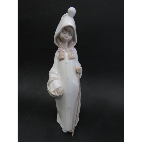 43 - Lladro figurine 'Wondering Angel' 4962 ,  along with a Lladro Shepherdess with basket and staff, app... 