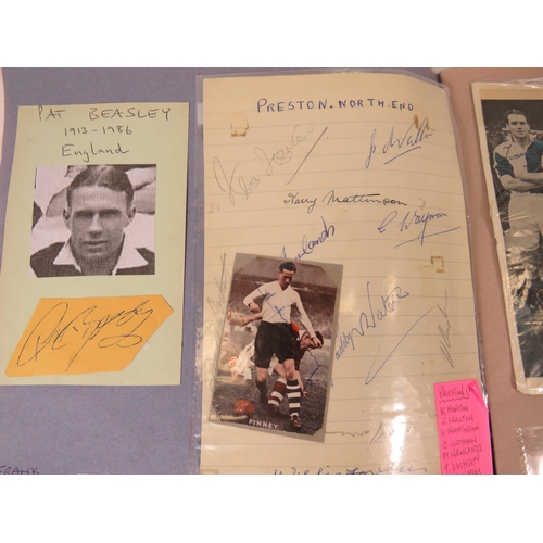 67 - Two interesting and well filled football related scrapbooks containing many autographed pictures and... 