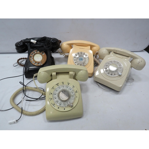 821 - 4 Vintage dial round telephones.