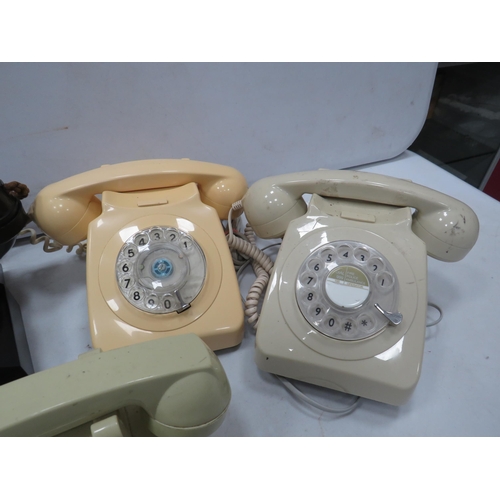 821 - 4 Vintage dial round telephones.