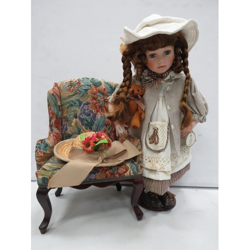 825 - Stuart Ross Porcelain doll and a dolls chair.