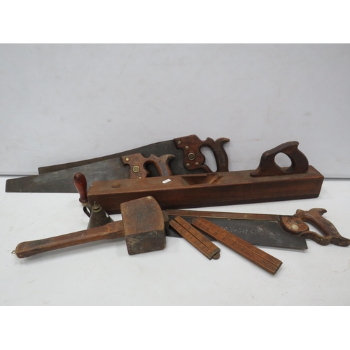 851 - Selection of vintage tools including Jointing plane body, wooden mallet, Saws and wooden rulers.