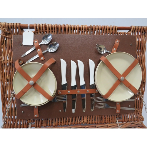 912 - Vintage picnic basket with Brexton accessories.