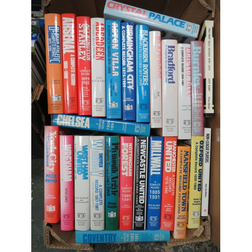 933 - 2 boxes of various football related books.