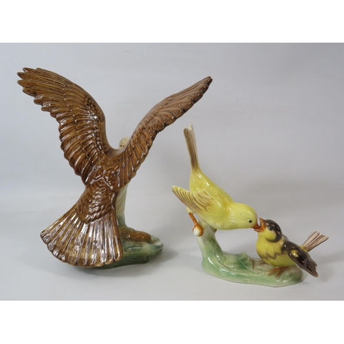 206 - Sylvac Osprey figurine (approx 22cm tall) and a Goebel Canary feeding a chick figurine.