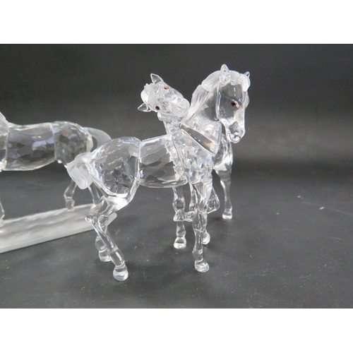 211 - 2 Swarovski crystal horse figurines, Stallion and pair of foals.