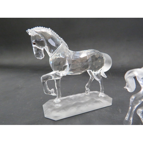 211 - 2 Swarovski crystal horse figurines, Stallion and pair of foals.