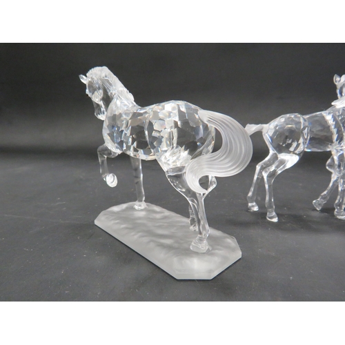 211 - 2 Swarovski crystal horse figurines, Stallion and pair of foals.