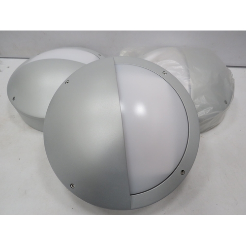 930 - 5 Outdoor eyelid bulk head lights in unused condition.