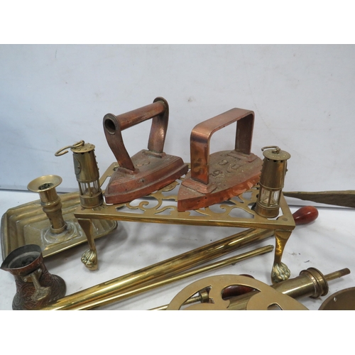 966 - Good selection of brass items, trivots, pumps, ornaments and two copper cast irons.