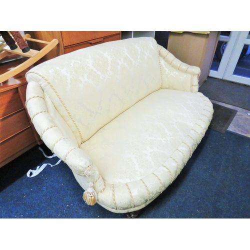 103 - Nicely upholstered Early 20th Century boudoir style two seater settee with Ivory fabric and tassles.... 