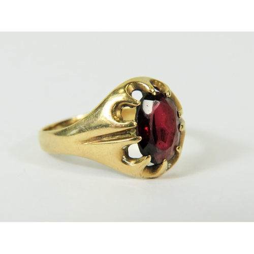 118 - 9ct Yellow Gold ring set with a large Central Garnet.  Finger size 'O-5' to 'P'   2.2g