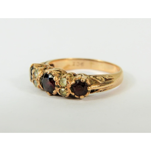 121 - Gypsy style 9ct Yellow Gold Ring set with Garnets and Clear Gemstones.   Finger size 'Q'   4.0g